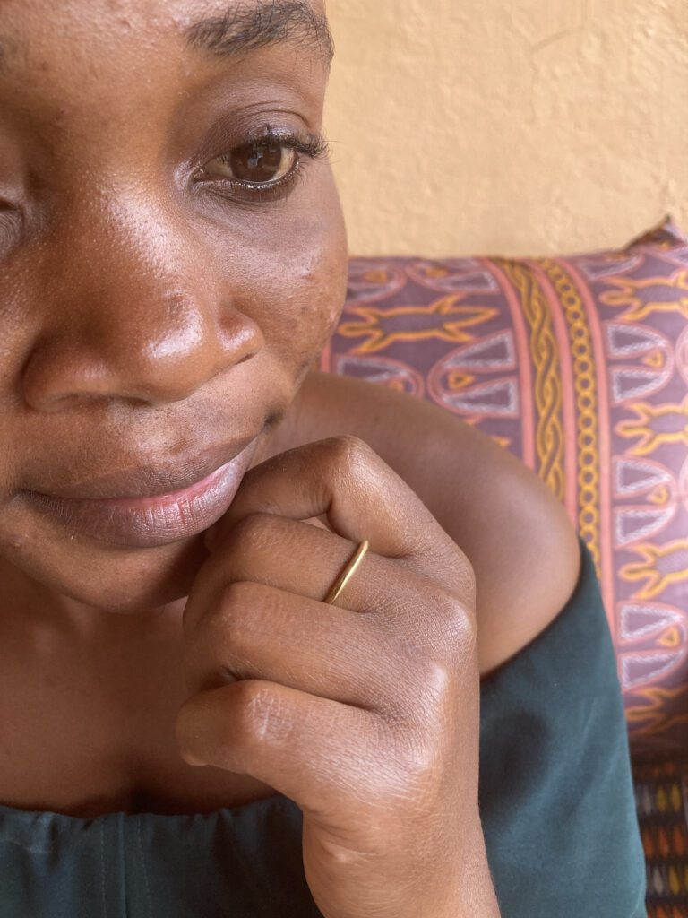 woman wearing a simple brass ring